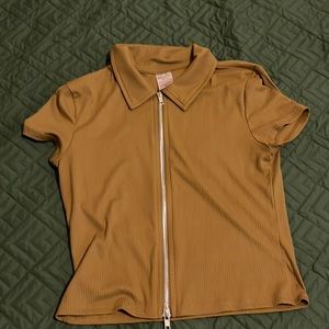 Cute top that zips up the from made from polyester